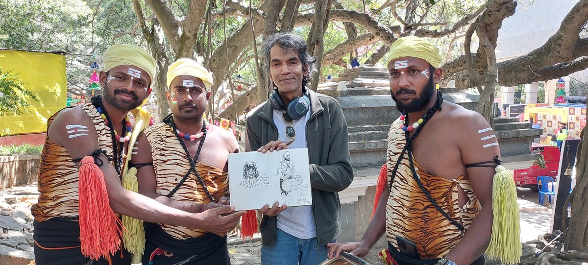 The author posing with members of a huli-vesha folk dance group